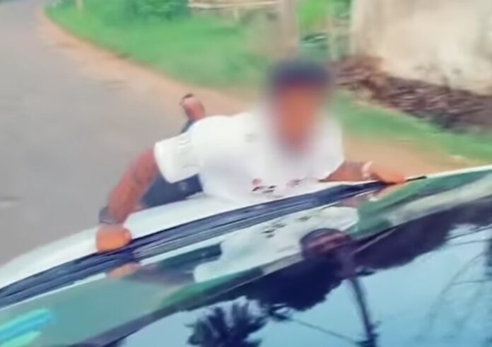 Daring or Dangerous? Viral Video of Man on Car Bonnet Triggers Police Alert