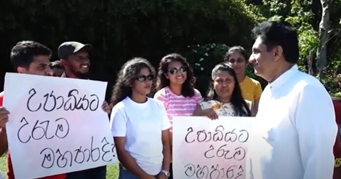 Sajith meets protesting unemployed graduates near Parliament